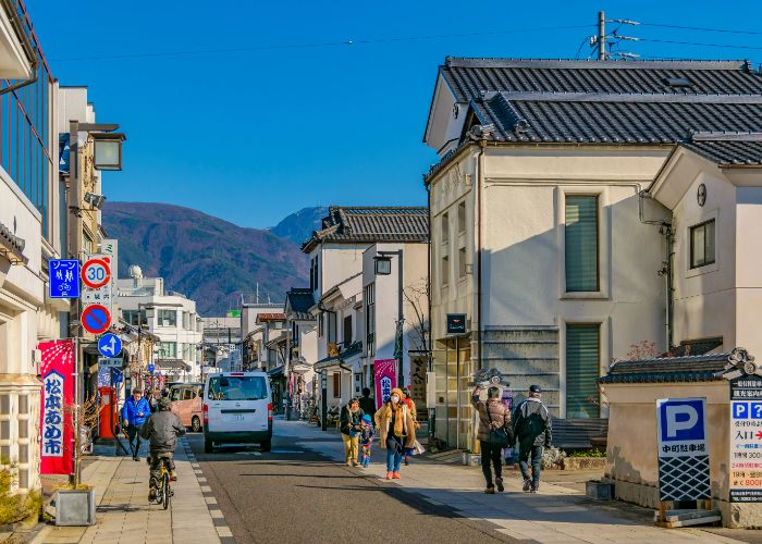 People wander the streets of the Nakamachi District in Matsumoto